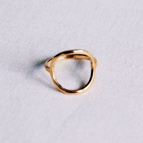 Gold open round ring worn on hand