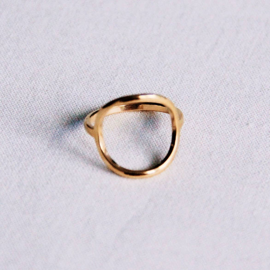 Gold open round ring worn on hand