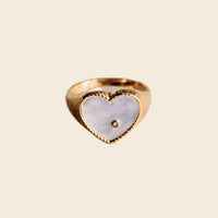 Gold ring with mother-of-pearl heart